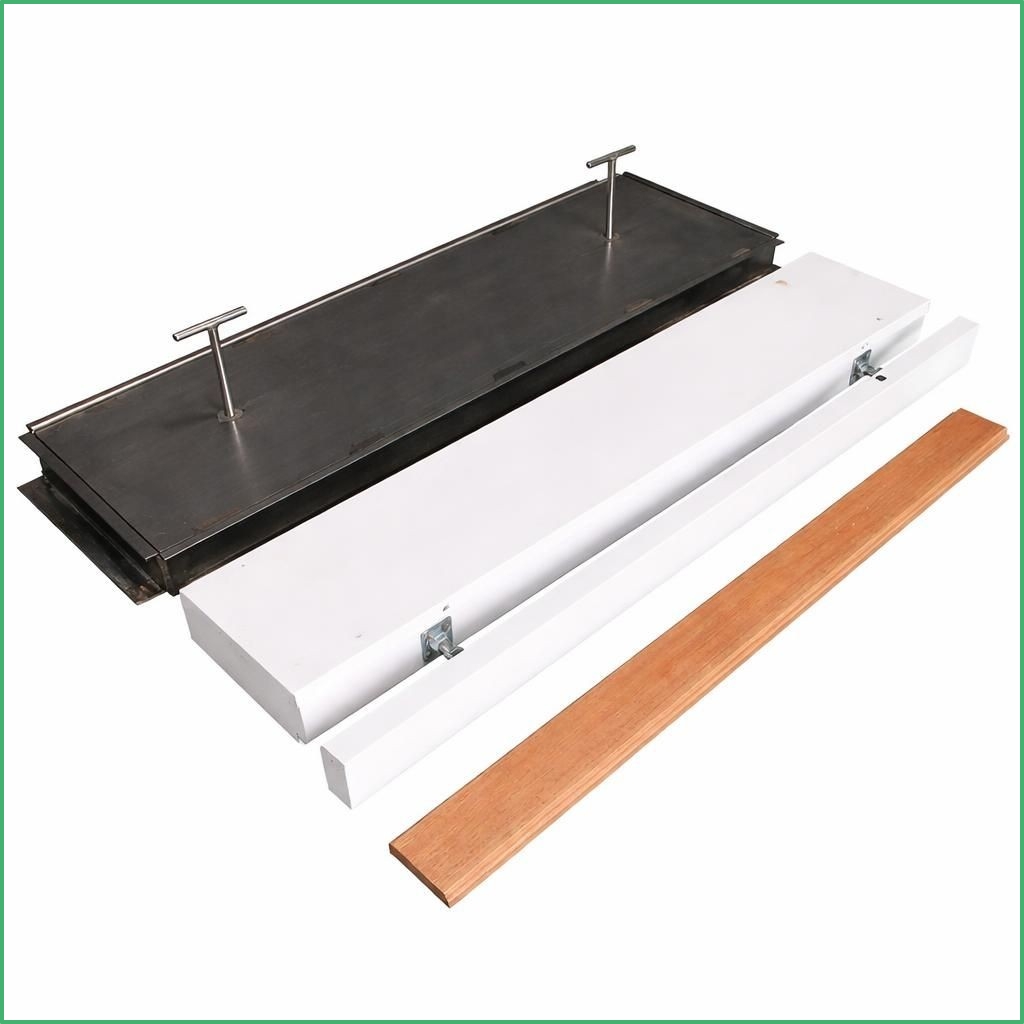 Synsport sports equipment - Take Off Board tray and lid sytem | Synsport Long metal clamp jig with two T-handle clamps on a black plate, resting on a white base with a wooden strip nearby.