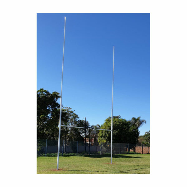 GT Rugby Posts 10m Standard Mild Steel 1 | Synsport Two white rugby goalposts on a grassy field beneath a clear blue sky, with trees in the background.