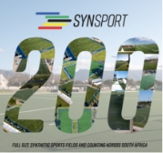 200 Full Size Synthetic Sports Fields | Synsport Promotional banner showing the year 2017 with a beach and water-sports background and the SYNSPORT logo