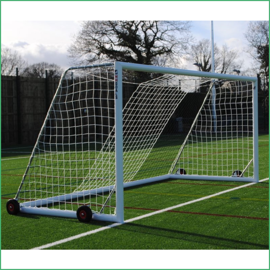Synsport sports equipment - 9v9 soccer goals free standing units 1 | Synsport Portable soccer goal on a green field with a white frame, netting, and wheels for easy transport.